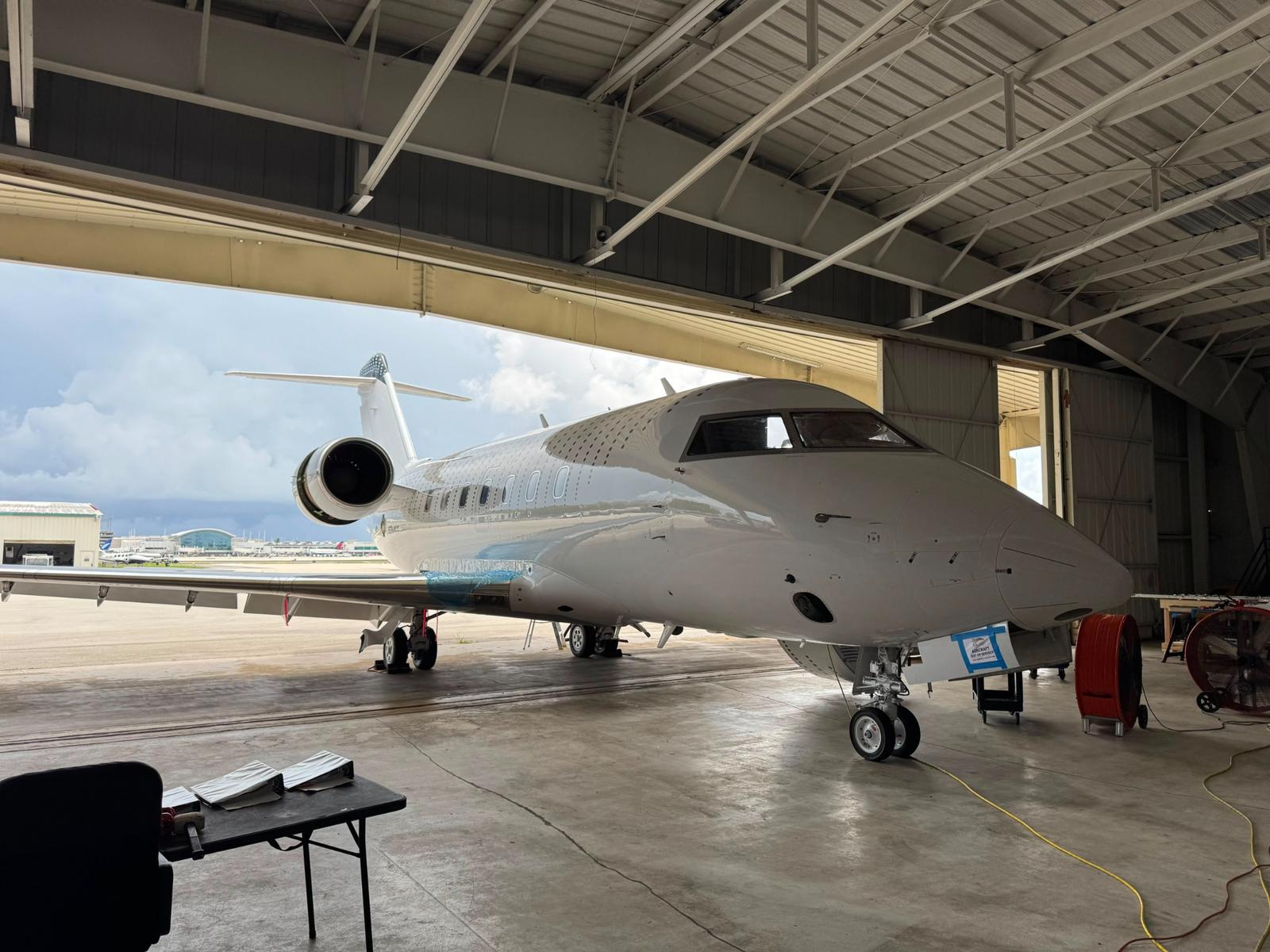 Business jet positioned in the hangar during 305 Sky maintenance and service.
